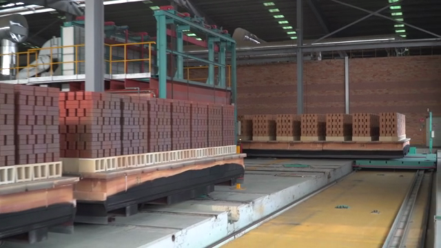 Stacks of bricks in a factory setting