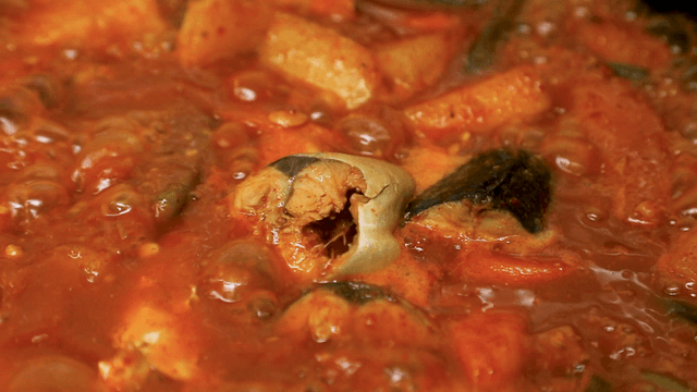 Mackerel stew boiling in a pot