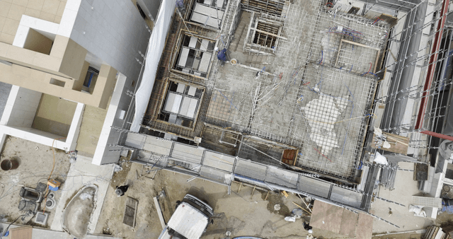 Construction site with scaffolding and workers