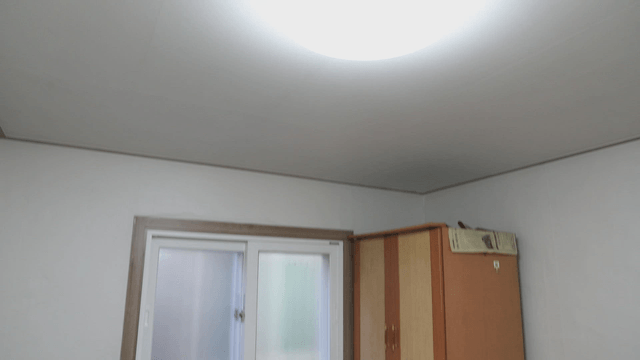 Simple room with a window and furniture