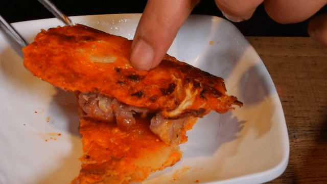 Kimchi pancake with pork on a plate