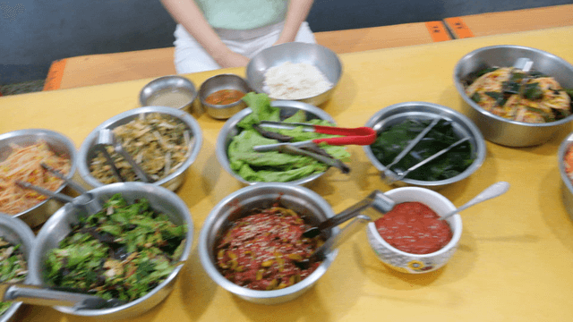 Assorted barley rice side dishes on table
