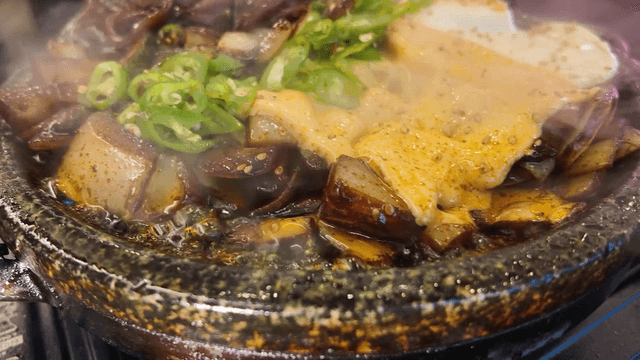 Cheese egg sizzling on iron plate