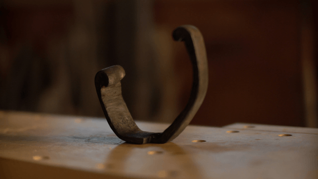 Unique wooden sculpture on woodworking table