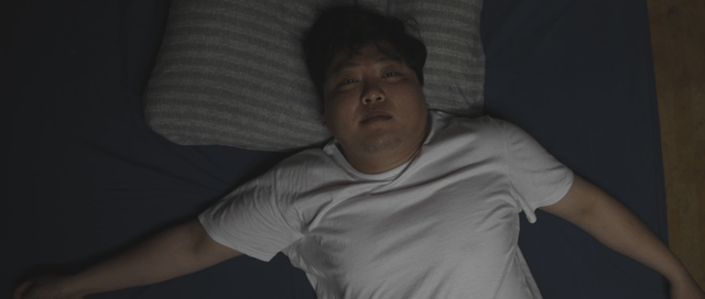 Person lying in bed