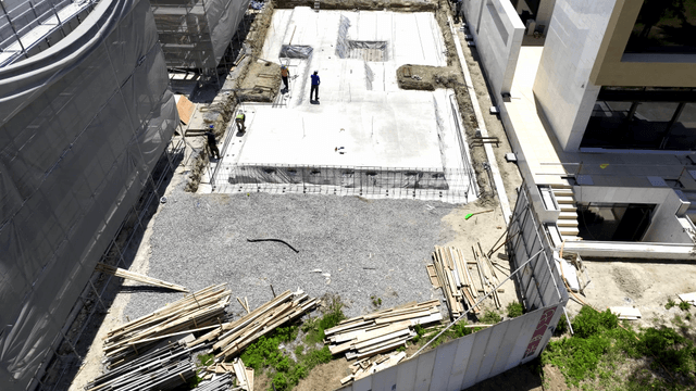 Construction site with workers and materials