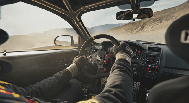 Rally driver navigating a dusty track