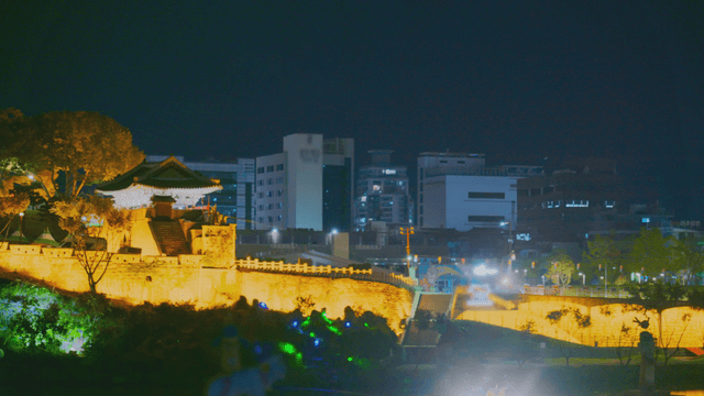 Night view of Korean traditional fortress in the city