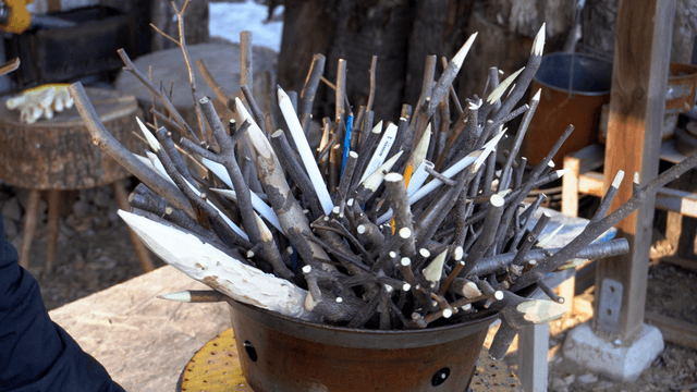 Rotating sharp wooden pencil stick in craft workshop