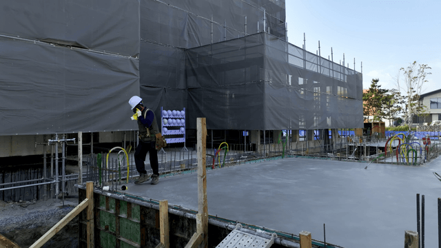 Construction worker inspecting a site