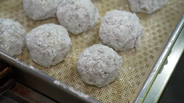 Dough balls prepared on a tray