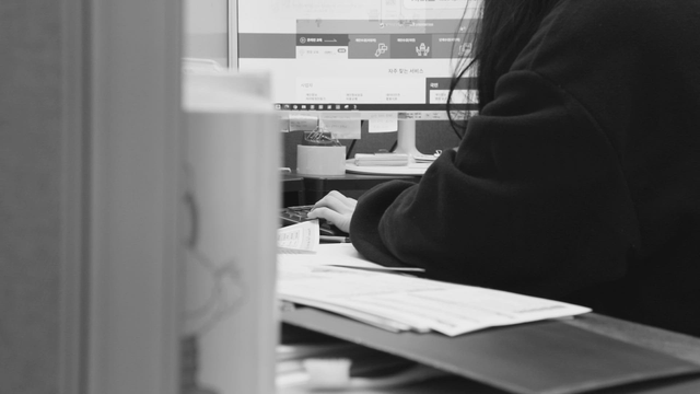 Person working at a computer in an office