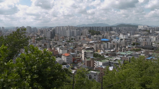 A sprawling cityscape with lush greenery