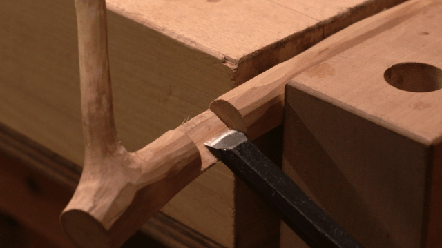 Chisel carving precisely on a workbench
