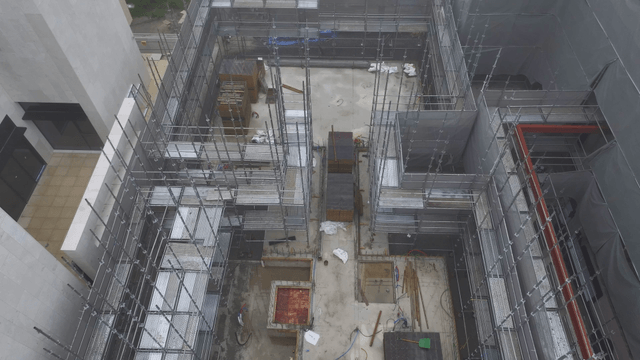 Construction site with scaffolding and workers