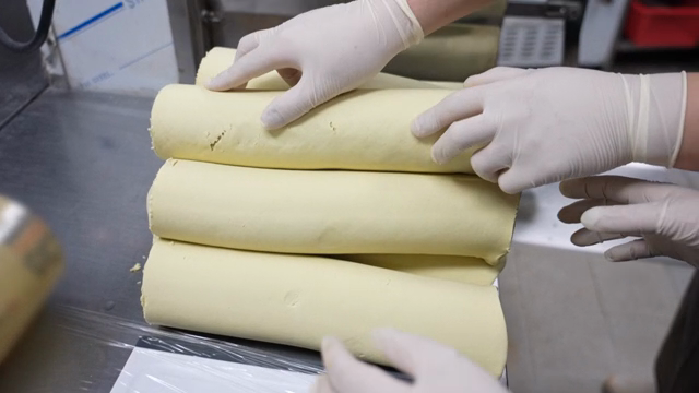Dough being prepared in a kitchen