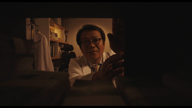 Doctor happy seeing stacked money