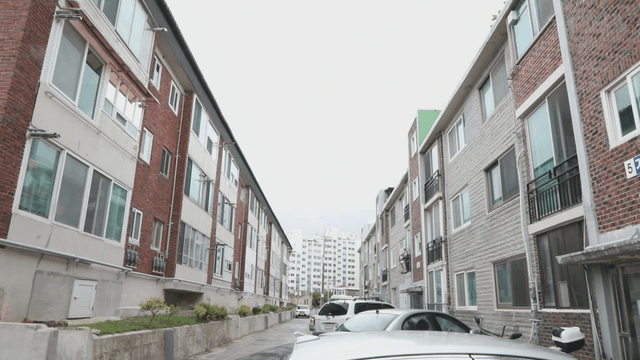 Quiet residential street with parked cars