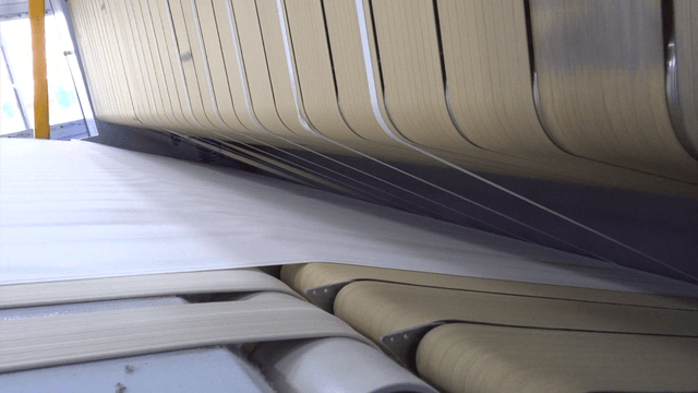 Conveyor belt of factory machine spreading fabric