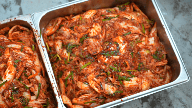 Freshly made kimchi on stainless tray