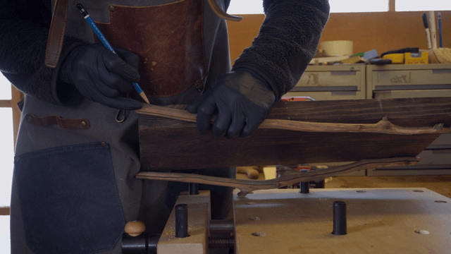 Craftsman working on a wooden board