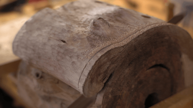 Hand saw steadily cutting through wood