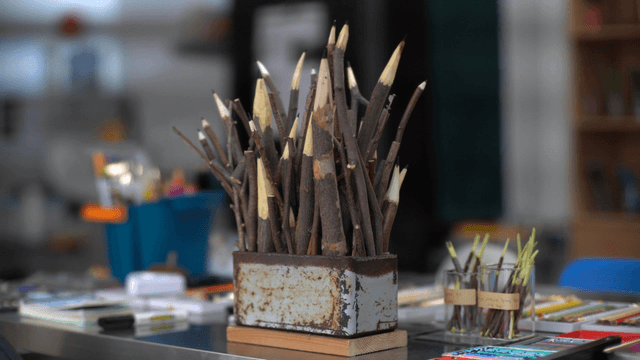 Wooden branch pencil sculpture on art activity table