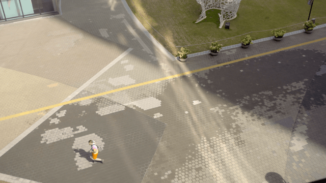 Person walking in a modern plaza