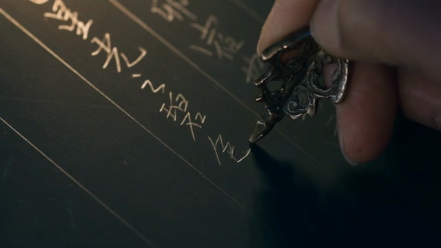 Intricate writing with a metal pen