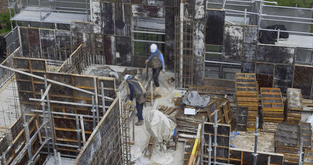 Construction workers building a structure