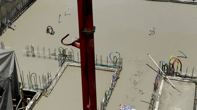 Construction workers pouring concrete