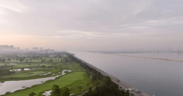 Serene landscape with a golf course and river
