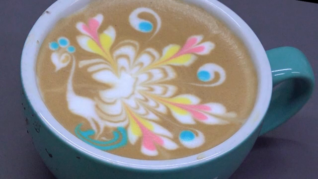 Colorful latte art in a coffee cup