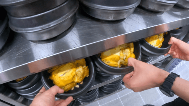 Boiled chickens placed in numerous earthen pots