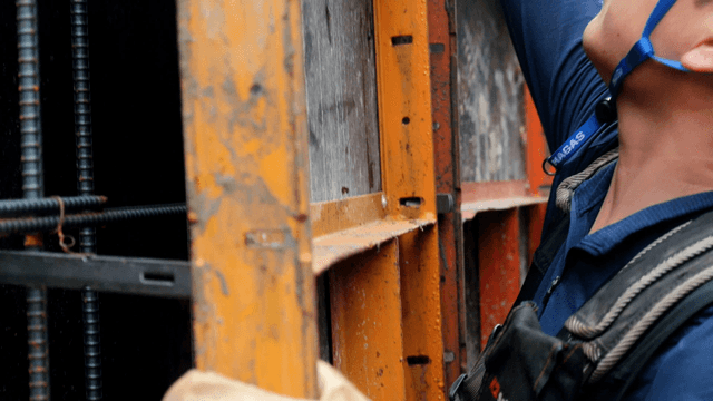 Construction worker assembling metal frames