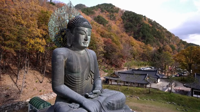 Large Buddha statue in a mountain setting