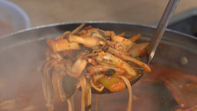 Spicy razor clam jjigae boiling in a pot