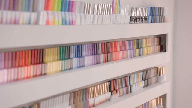 Colorful nail polish products on display shelves