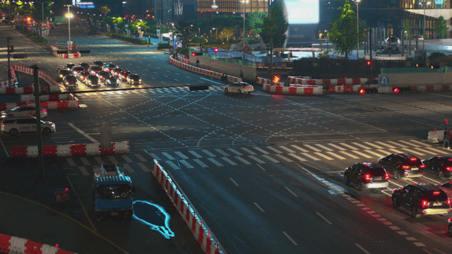 Busy intersection at night