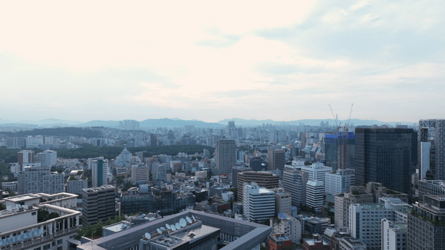 Sprawling cityscape under a cloudy sky