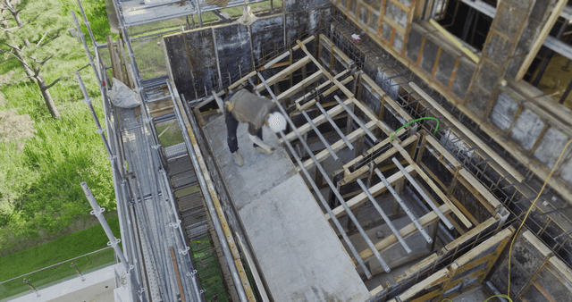 Construction site with scaffolding and workers