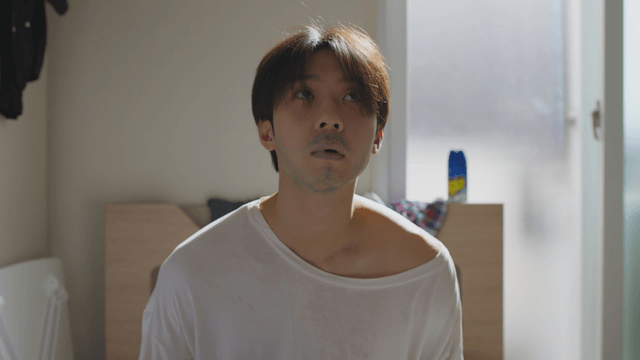 Tired man sitting in a sunlit room
