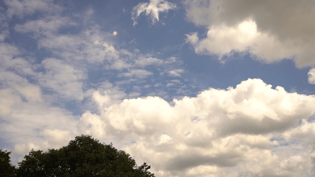 Scattered clouds in blue sky