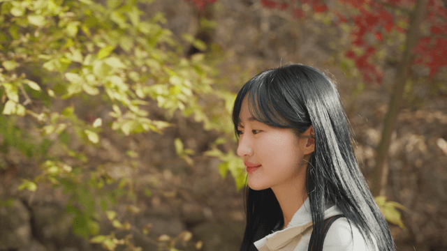 Woman hiking through autumn foliage
