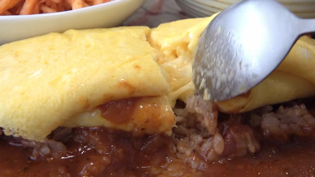 Omelette cut with a spoon