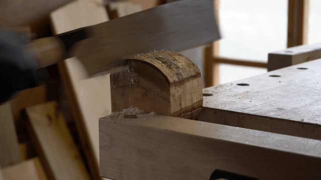 Wood being cut with a saw in a workshop