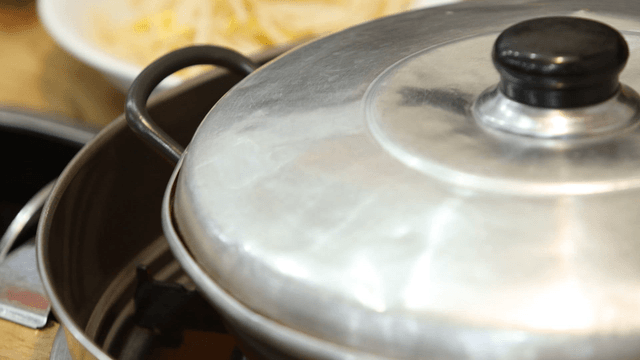 Pot with kimchi on a table