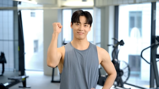 Young man clenching his fist in a gym
