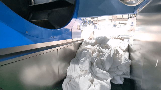 White sheets processed in large machine