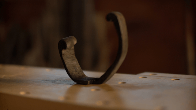 Wooden sculpture piece on woodworking table